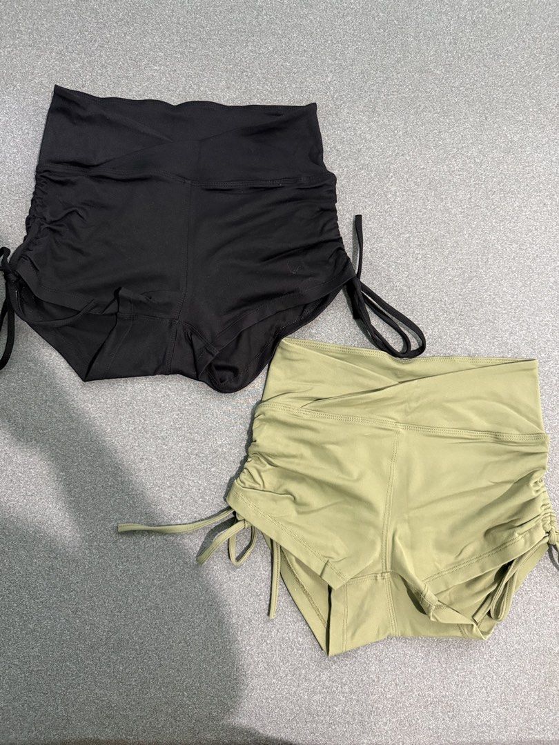 Two Ruched Drawstring Yoga Shorts (Black & Khaki) (Category: Shorts) located in Paranaque City. Submitted by prelovedbyysa (Listing ID 1462473455, Image 1). Description: - Ruched drawstring shorts - Available in Black and Khaki Green - High-waisted design - Adjustable side ties for a custom fit - Comfortable and stretchy material - Perfect for workouts SIZE SMALL NO FLAWS.