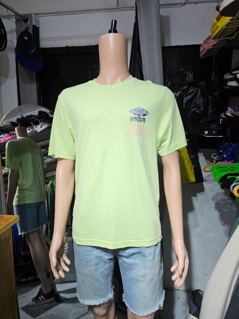 Umbro T-shirt (Category: Activewear) located in Baguio. Submitted by kayeonlineshop (Listing ID 1462538404, Image 1). Description: -light green crewneck T-shirt featuring a small graphic print on the left chest. -measurements in included jn the photos.