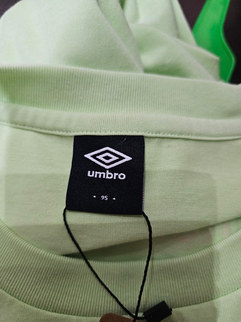 Umbro T-shirt (Category: Activewear) located in Baguio. Submitted by kayeonlineshop (Listing ID 1462538404, Image 3). Description: -light green crewneck T-shirt featuring a small graphic print on the left chest. -measurements in included jn the photos.