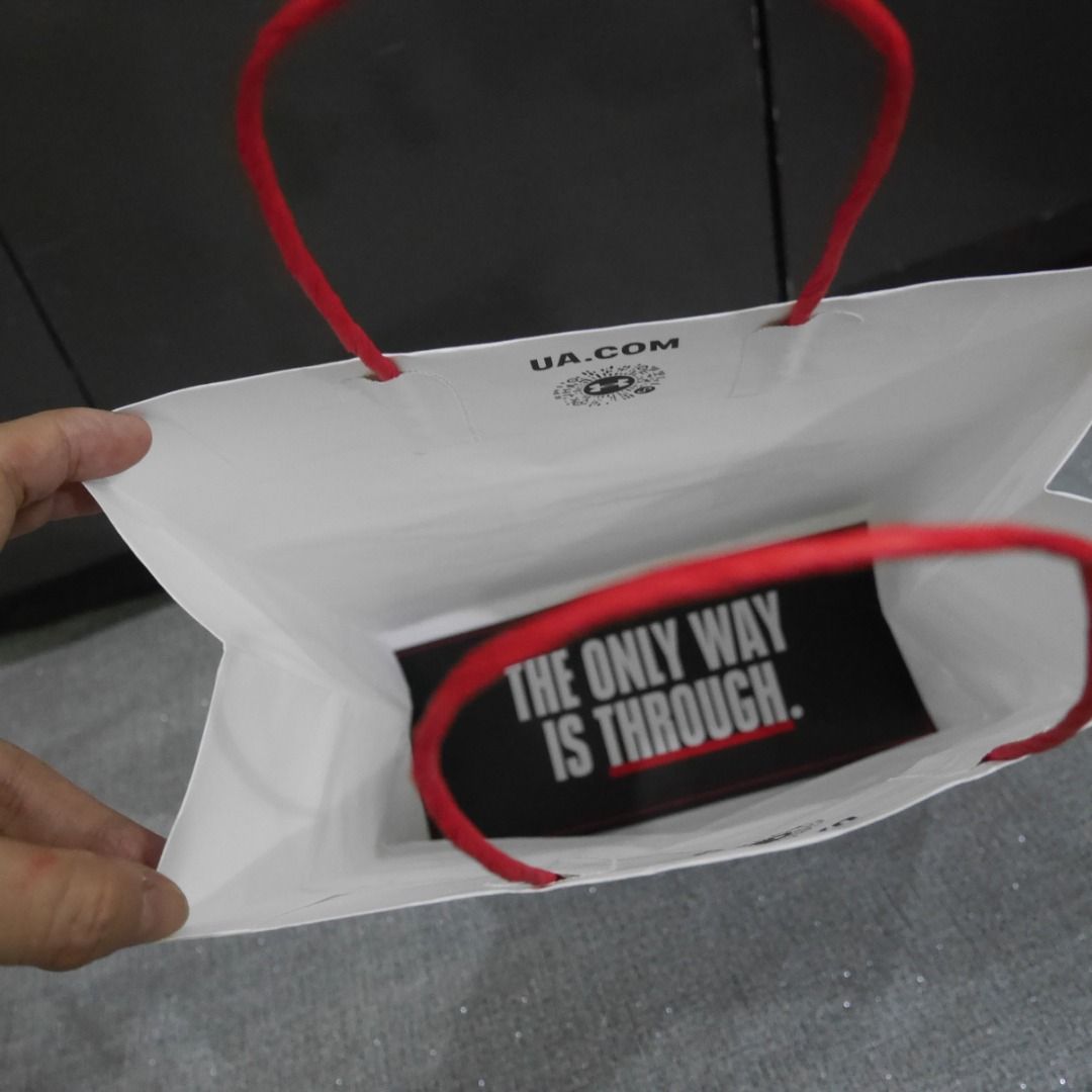 Under Armor Paper Bag (Category: Other Stationery & Craft) located in Valenzuela. Submitted by cletini (Listing ID 1462629251, Image 2). Description: Fits 1 shoebox Approx. dimensions: " W × " H × 5" D Condition Statement (Very Important): • Authentic: Guaranteed 100% original. • Swipe photos for paper bag size • The paper bag was used only once to transport the purchased item. • Condition : Please see photos for actual item and condition. • Tran