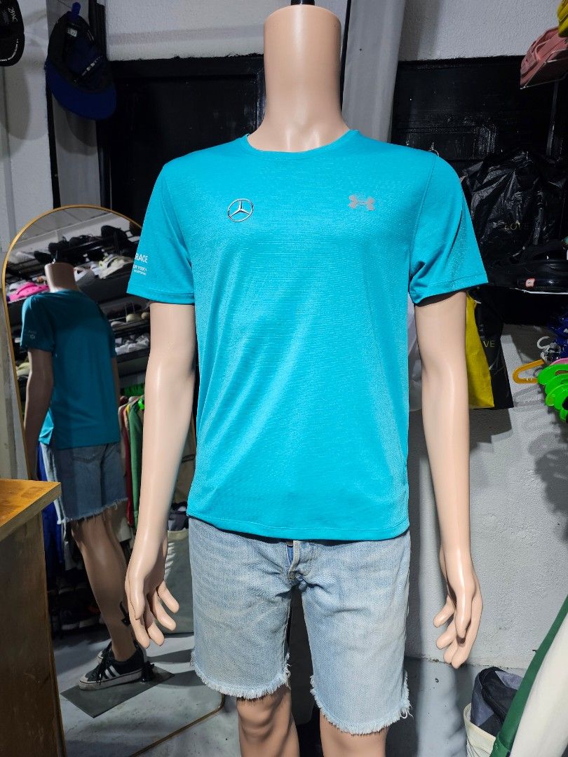 Under Armour functional short-sleeve t-shirt (Category: Activewear) located in Baguio. Submitted by kayeonlineshop (Listing ID 1462537366, Image 1). Description: -bright blue Under Armour functional short-sleeve t-shirt featuring a silver Mercedes-Benz logo on the chest.