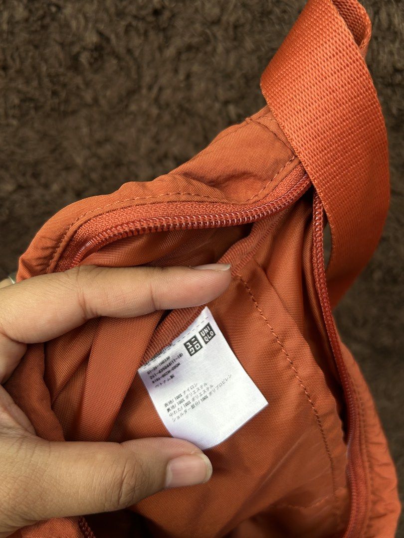Uniqlo Orange Sling Bag (Category: Sling Bags) located in Naga. Submitted by helloitsk20594 (Listing ID 1462467301, Image 3). Description: 7 x 11 inches.
