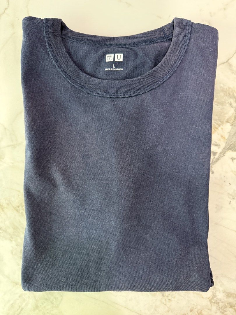 Uniqlo U Navy Blue Shirt (Category: Tshirts & Polo Shirts ) located in Manila. Submitted by heatsneakerstoreph (Listing ID 1462498547, Image 1). Description: Slightly Used 9/10 Condition Size L RFS: Decluttering hindi na po mag fit sakin .