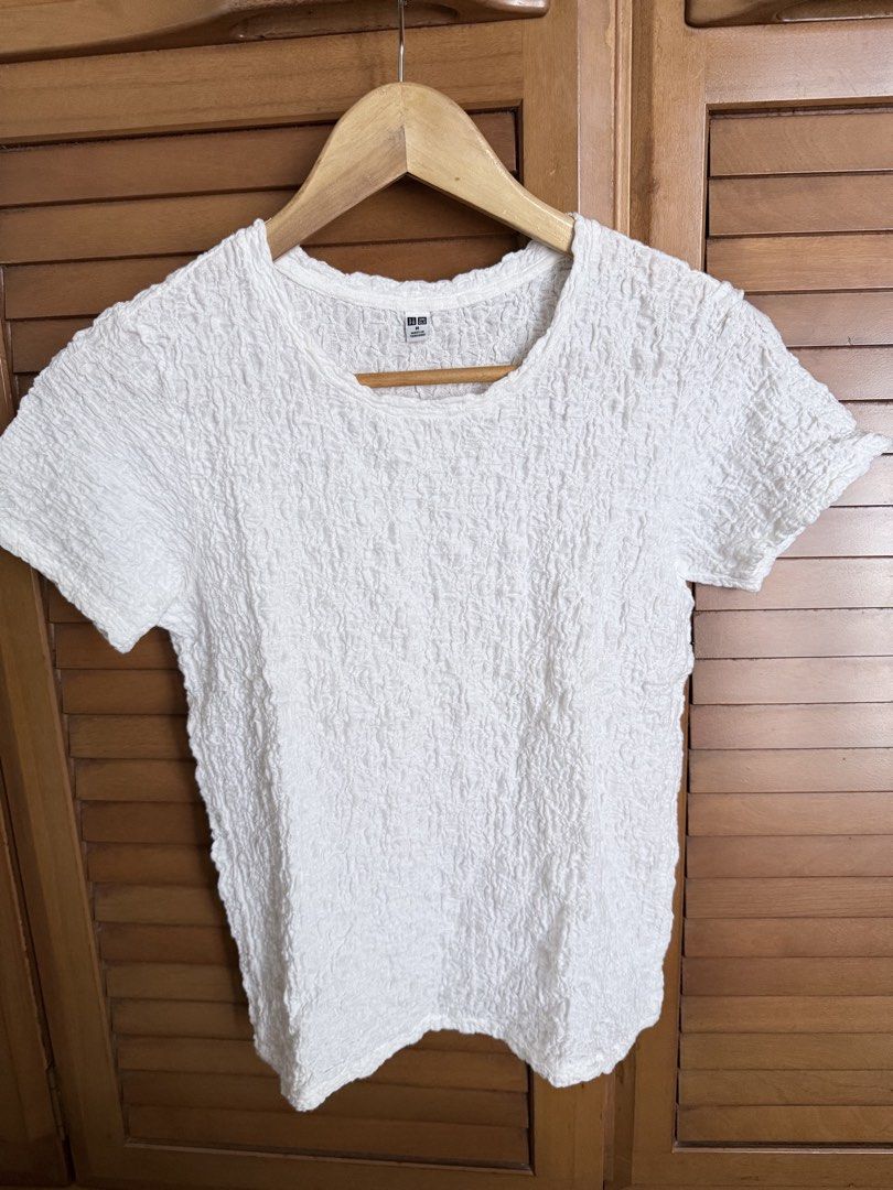 Uniqlo White Textured Shirt (Category: Blouses) located in Paranaque City. Submitted by roanclauds (Listing ID 1462541142, Image 1). Description: - Tag removed - Textured fabric all over - Short sleeves and crew neck - Made from a comfortable cotton, nylon, and spandex blend - Stretchy and easy to pair with jeans or skirts - A great basic for any wardrobe.