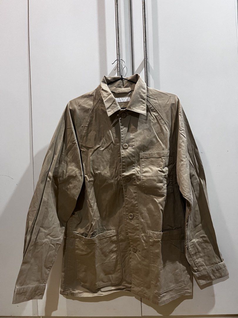 Uniqlo Work Jacket Beige (Category: Coats, Jackets and Outerwear) located in Quezon City. Submitted by reecepalafox (Listing ID 1462511523, Image 3). Description: - Classic work jacket style in beige cotton twill. - Two chest pockets and two lower patch pockets for ample storage. - Button front closure for easy wear. - Raglan sleeves for a comfortable fit and modern look. - Ideal for layering over various outfits. - Highly versatile for casual or