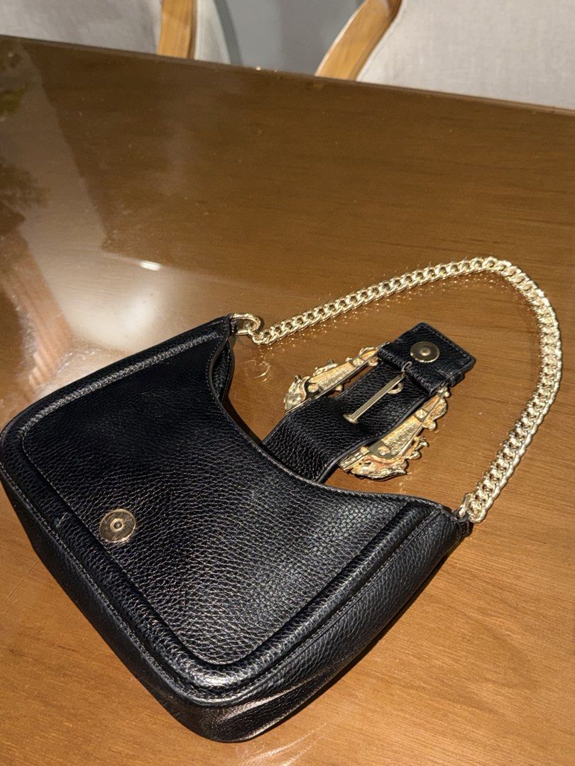 Versace Jeans Couture (Category: Shoulder Bags) located in Manila. Submitted by grand.preloved.club (Listing ID 1462646655, Image 3). Description: Authentic Versace Jeans Couture in black with Gold Baroque buckle and chain. • 10/10 Condition • Impulsive buy hehe • super nice in person, good for night out and dinners. • Very classy!! • Never been used as in, super steal. See reference for orig price RFS: Decluttering .