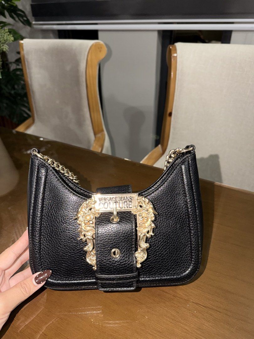 Versace Jeans Couture (Category: Shoulder Bags) located in Manila. Submitted by grand.preloved.club (Listing ID 1462646655, Image 1). Description: Authentic Versace Jeans Couture in black with Gold Baroque buckle and chain. • 10/10 Condition • Impulsive buy hehe • super nice in person, good for night out and dinners. • Very classy!! • Never been used as in, super steal. See reference for orig price RFS: Decluttering .