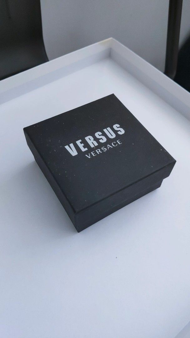 Versus Versace Logo Choker Necklace (Category: Necklaces) located in Makati City. Submitted by trevarucci (Listing ID 1462550792, Image 3). Description: - Genuine black leather choker with stainless steel. - Features silver 'VERSUS' logo letters - Adjustable silver chain for a perfect fit - Comes with the original Versus Versace box - A bold statement accessory to elevate any look.