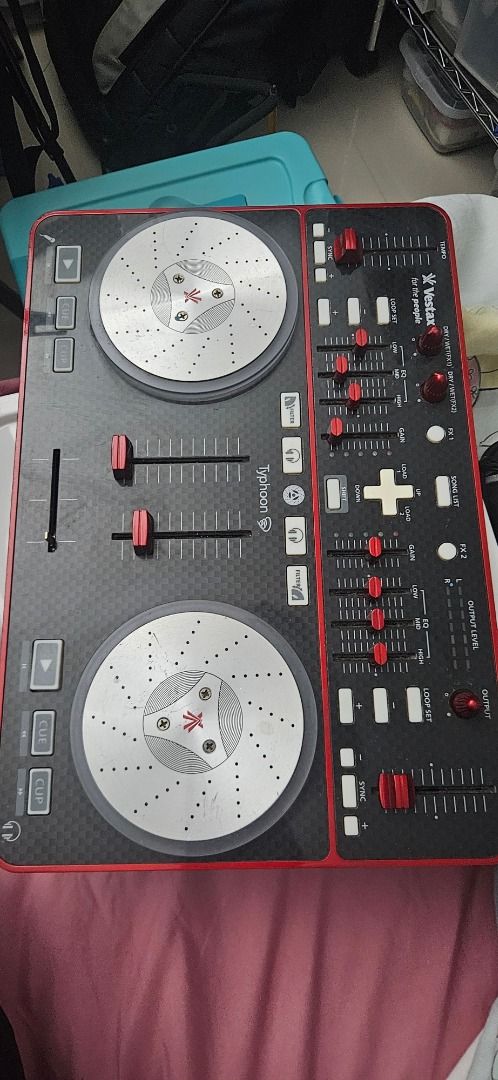 Vestax Typhoon DJ Controller by Numark (Category: Other Audio Equipment) located in Paranaque City. Submitted by negative_view (Listing ID 1462624031, Image 3). Description: - Vestax Typhoon DJ Controller - Excellent working condition - Features two jog wheels and faders for seamless mixing - Includes EQ and gain controls for sound shaping - Loop set function for creative track manipulation - Ideal for aspiring DJs and practice sessions - Reason 