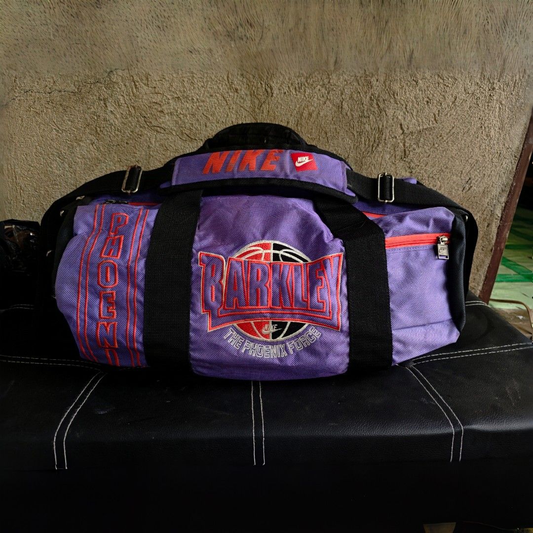 Vintage 1994 NIKE Barkley Phoenix Force Duffle Bag (Category: Sling Bags) located in Ipil. Submitted by ajthriftfinds (Listing ID 1462491353, Image 1). Description: - Cool purple Nike duffel bag - Features Barkley Phoenix Force design - Main compartment - Side zip pocket - Adjustable shoulder strap included - Perfect for gym or travel - Shows some signs of wear, but fully functional.