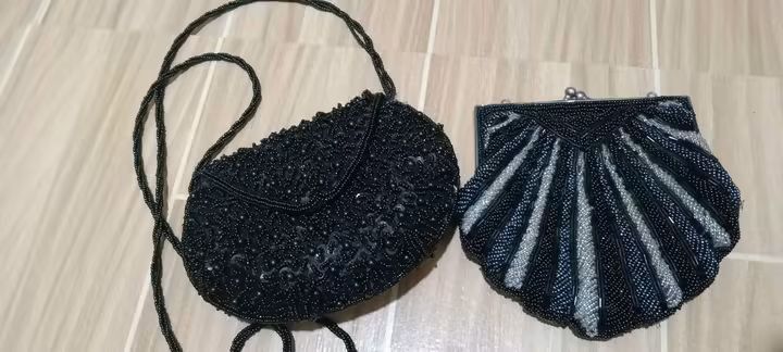 Vintage Beaded Evening Purses - Black and Shell Design (Category: Purses & Pouches) located in Gapan. Submitted by montesnora80204 (Listing ID 1462678236, Image 1). Description: - Set of two beaded evening purses - Classic black purse with sequins and long beaded strap - Unique shell-shaped purse with black and silver beads - Both feature luxurious satin lining - Compact size, ideal for parties and special occasions.