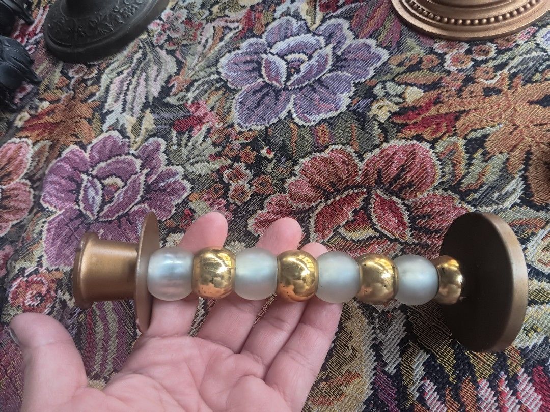 Vintage Brass and Gold Candlesticks Set (Category: Other Home Decor) located in Las Pinas. Submitted by jesus1smysavi0r (Listing ID 1462529236, Image 3). Description: TAKE ALL!!! Set of vintage candlesticks perfect for home decor or special occasions. - Two gold-painted candlesticks with ornate bases. - One darker brass candlestick featuring intricate vine and grape detailing. - One smaller, unique candlestick with frosted and gold bead accents. 