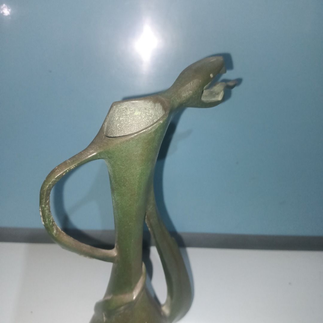 Vintage Brass Snake Design Vase (Category: Vases & Decorative Bowls) located in Munoz. Submitted by larryc1212 (Listing ID 1462480242, Image 2). Description: - Unique brass vase with intricate snake design - Non magnetic - Snake coils around the body, head forms the spout - Approximately 8 inches tall - Perfect for display or as a unique planter - Shows natural patina consistent with age Disclaimer: Item may include some scratches due to age, as 