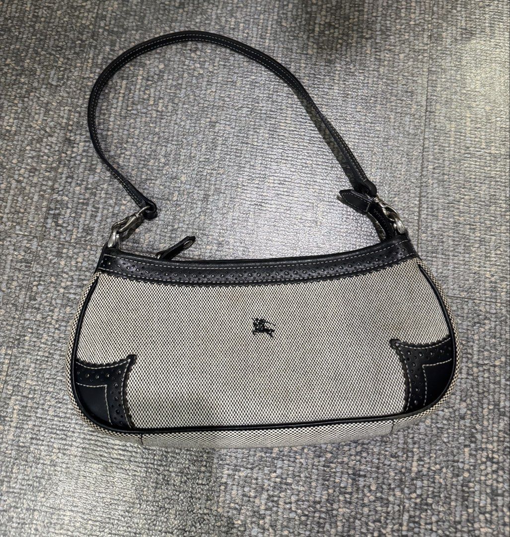 Vintage Burberry Blue Label Canvas (Category: Luxury Bags & Wallets) located in Angeles City. Submitted by thala.1204.68 (Listing ID 1460924195, Image 3). Description: - Authentic Classic Burberry shoulder bag with B101 Revue certificate for authenticity/100% authentic - Beige canvas with black leather trim - Iconic equestrian knight logo - Striped interior lining - Interior zip pocket - Compact size, ideal for essentials - Detachable wrist strap