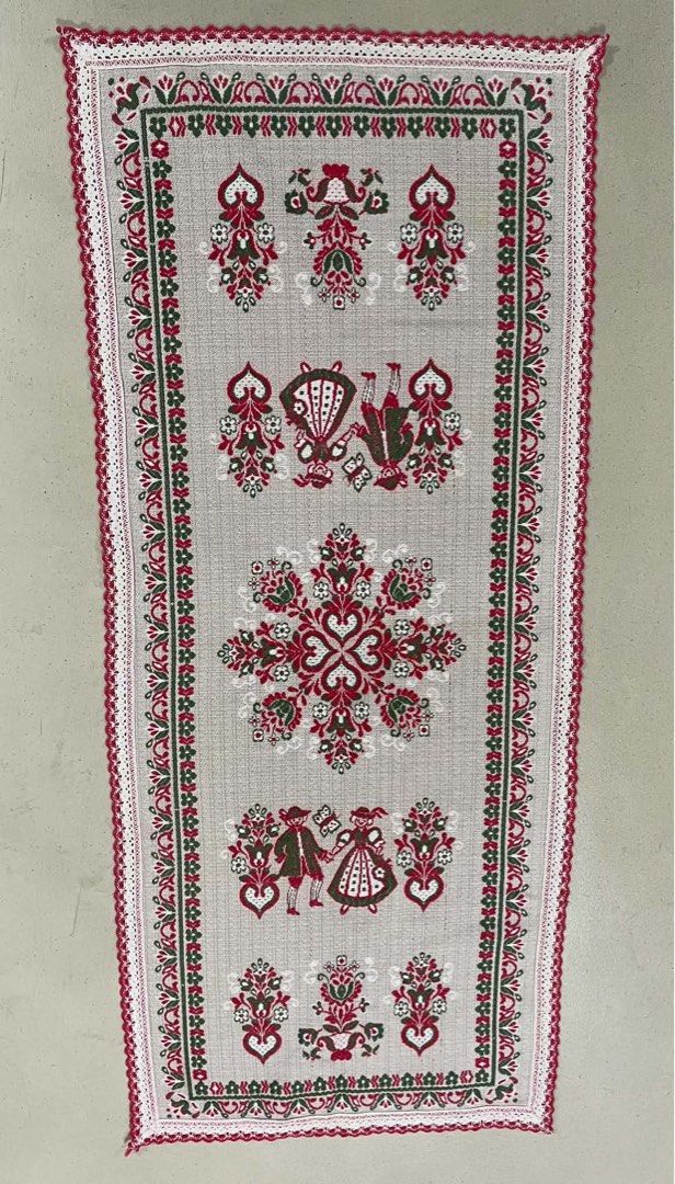 Vintage Embroidered Table Runner - Folk Art Design (Category: Table Linen & Textiles) located in Quezon City. Submitted by meggoquingco (Listing ID 1462521404, Image 2). Description: - Beautiful embroidered table runner - Folk art design with intricate red and green patterns - Features delicate lace trim - Adds a charming touch to any table setting - Ideal for holiday or everyday decor.