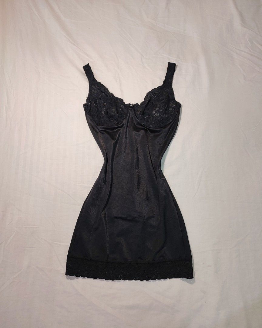 vintage Flexees Black Lace Trim Shapewear (Category: Undergarments & Loungewear) located in Jaen. Submitted by roxantiago (Listing ID 1462674138, Image 1). Description: - Black satin slip dress - Delicate lace trim on bust and hem - Adjustable straps for a perfect fit - Estimated size: Medium ( fits S to M). 38B on tag - Comfortable and silky material - Versatile: great for layering or wearing solo - Ideal for nights out or relaxing at home.