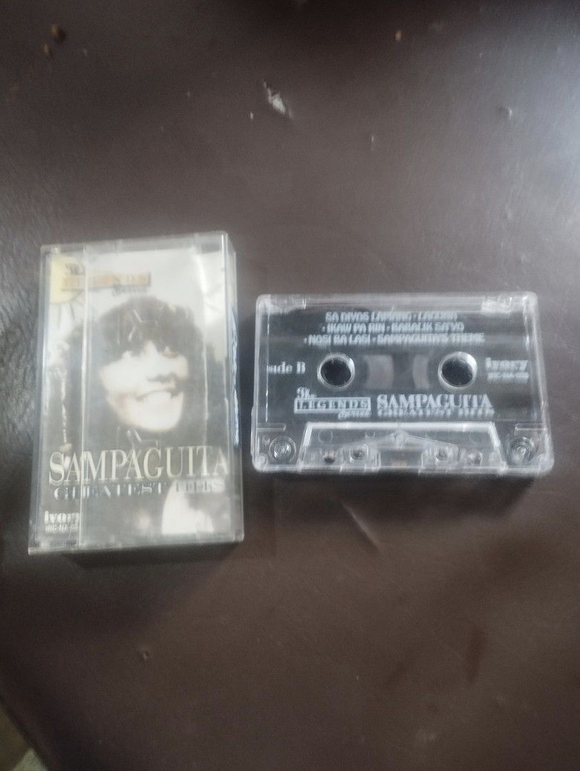 VINTAGE SAMPAGUITA CASSETTE TAPE (Category: CDs & DVDs) located in Mandaluyong City. Submitted by LEATHERFACE (Listing ID 1462477694, Image 2). Description: - Sampaguita Greatest Hits cassette tape - From The Legends Series - Features OPM classics: 'Sa D'yos Laging Lagan', 'Ikaw Pa Rin', 'Babalik Sayu' - Includes 'Noy Na Lasi - Sampaguita's Theme' - Released by Ivory Music - Ideal for collectors of OPM classics.