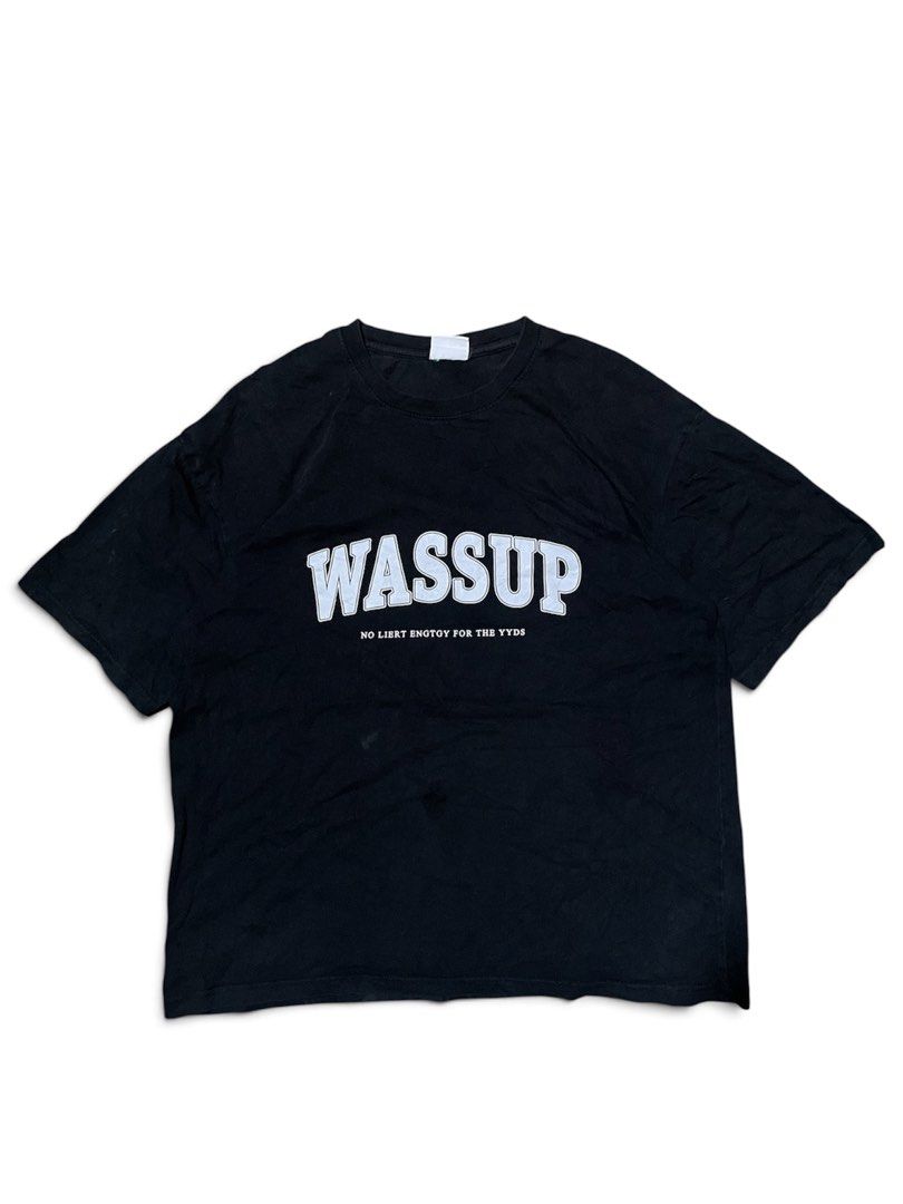 WASSUP Graphic T-Shirt (Category: Tshirts & Polo Shirts ) located in Munoz. Submitted by bb_jimbo0 (Listing ID 1462626574, Image 1). Description: - Black graphic t-shirt - Features 'WASSUP' text - Includes smaller text: 'NO LIERT ENGTOY FOR THE YYDS' - Simple and casual design - Ideal for everyday wear.