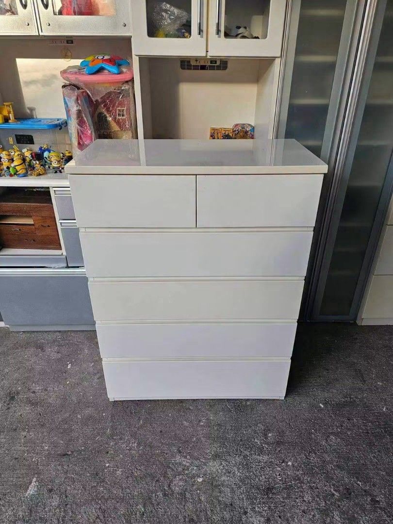 White 6-Drawer Dresser Chest (Category: Shelves, Cabinets & Racks) located in Manila. Submitted by Hezcki (Listing ID 1462606031, Image 1). Description: - White dresser with 6 drawers - Top two drawers are smaller - Plenty of storage space for clothes and other items - Simple and clean design - Fits well in most rooms.