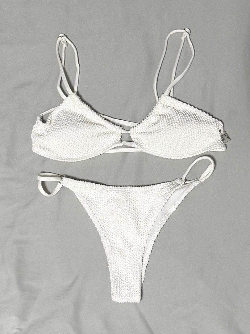 White Bikini Set (Category: Bikinis & Swimsuits) located in Caloocan City. Submitted by chiblonded (Listing ID 1462548884, Image 1). Description: - White textured bikini set - Triangle top with adjustable straps - Matching high-cut bottoms with loop detail on sides - Ideal for beach or pool - Comfortable and stylish.