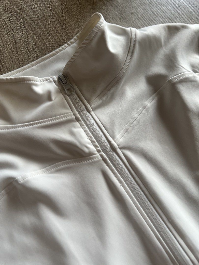 White High Neck Zip Up Jacket & Cargo Pants Set (Category: Sets or Coordinates) located in Cainta. Submitted by thingsfromerika (Listing ID 1462473262, Image 2). Description: - White long sleeve zip-up jacket with high neck - Thumbholes on sleeves for extra comfort - Matching white cargo pants - Elastic waistband for a flexible fit - Small green heart detail on cargo pocket - Comfortable and stylish matching set.