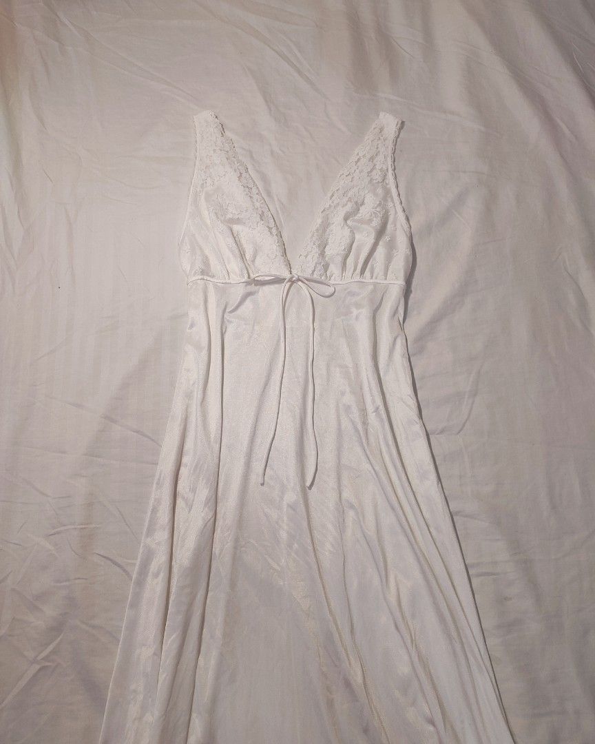 White Lace Trimmed Maxi Nightgown (Category: Undergarments & Loungewear) located in Jaen. Submitted by roxantiago (Listing ID 1462671180, Image 2). Description: - Long white nightgown - Silky fabric that drapes nicely - Features delicate lace trim on V-neckline and straps - Adjustable tie detail at the bust - Perfect for comfortable lounging or sleeping - Adds a touch of vintage charm to your sleepwear S to M flaw: faint blue stains. see photos .