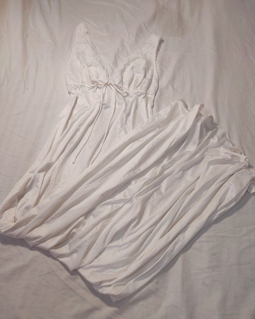 White Lace Trimmed Maxi Nightgown (Category: Undergarments & Loungewear) located in Jaen. Submitted by roxantiago (Listing ID 1462671180, Image 3). Description: - Long white nightgown - Silky fabric that drapes nicely - Features delicate lace trim on V-neckline and straps - Adjustable tie detail at the bust - Perfect for comfortable lounging or sleeping - Adds a touch of vintage charm to your sleepwear S to M flaw: faint blue stains. see photos .
