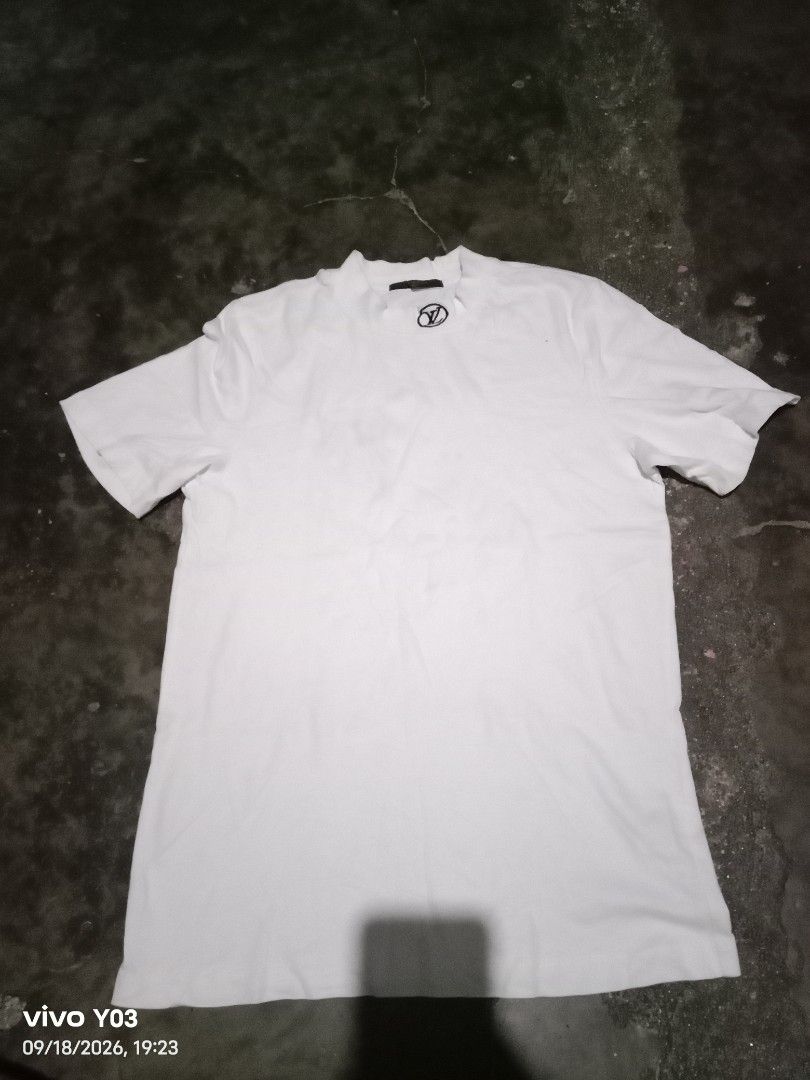 White Louis Vuitton Monogram T-Shirt (Category: Tshirts & Polo Shirts ) located in Cabuyao City. Submitted by blake657 (Listing ID 1462582098, Image 1). Description: - Classic white crew neck t-shirt - Features a small, embroidered Louis Vuitton monogram logo on the chest - Simple and clean design - Ideal for casual wear.