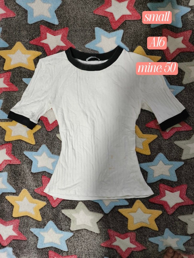 White Ribbed T-shirt with Black Trim (Category: Shirts) located in Cebu City. Submitted by straw.berry.milk.24 (Listing ID 1462647897, Image 1). Description: - White ribbed t-shirt - Black trim on collar and sleeves - Short sleeves - Faint yellow stains on the front (please check photos) - Ideal for casual wear.