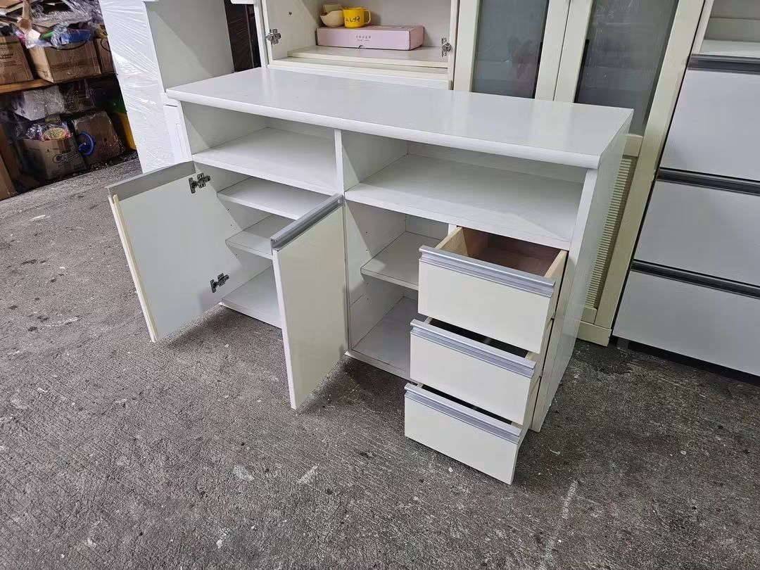 White Storage Cabinet with Doors and Drawers (Category: Shelves, Cabinets & Racks) located in Manila. Submitted by Hezcki (Listing ID 1462605793, Image 2). Description: - White storage cabinet - Two doors on the left with interior shelves - Three drawers on the right - Open shelves above doors and drawers - Ideal for organizing any space - Clean and simple design.