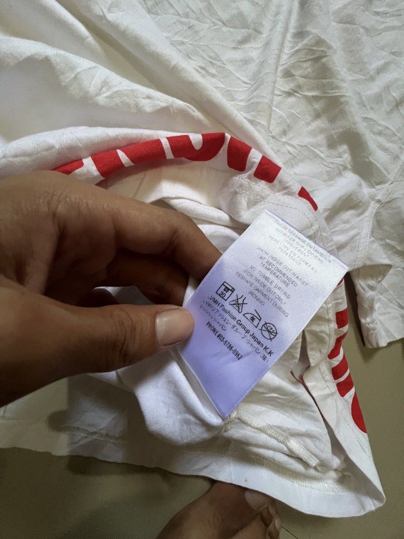 White T-shirt with Red Graphic Print (Category: Shirts) located in Caloocan City. Submitted by vintage2333 (Listing ID 1462617119, Image 1). Description: - Crisp white t-shirt featuring a bold red graphic print. - Crafted from 100% cotton with added elastane for comfort and stretch. - Care instructions conveniently located on the tag. - Ideal for casual everyday wear..