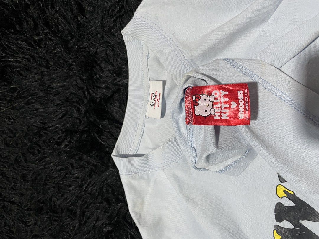 WHO'Sée Hello Kitty T-shirt Light Blue (Category: Shirts) located in Munoz. Submitted by bb_jimbo0 (Listing ID 1462626194, Image 3). Description: - Light blue t-shirt - Features 'WHO'Sée' graphic on the front - Adorable Kitty and bee graphic on the back - Made from soft, comfortable material - Perfect for casual everyday wear - Please check photos for detailed views.