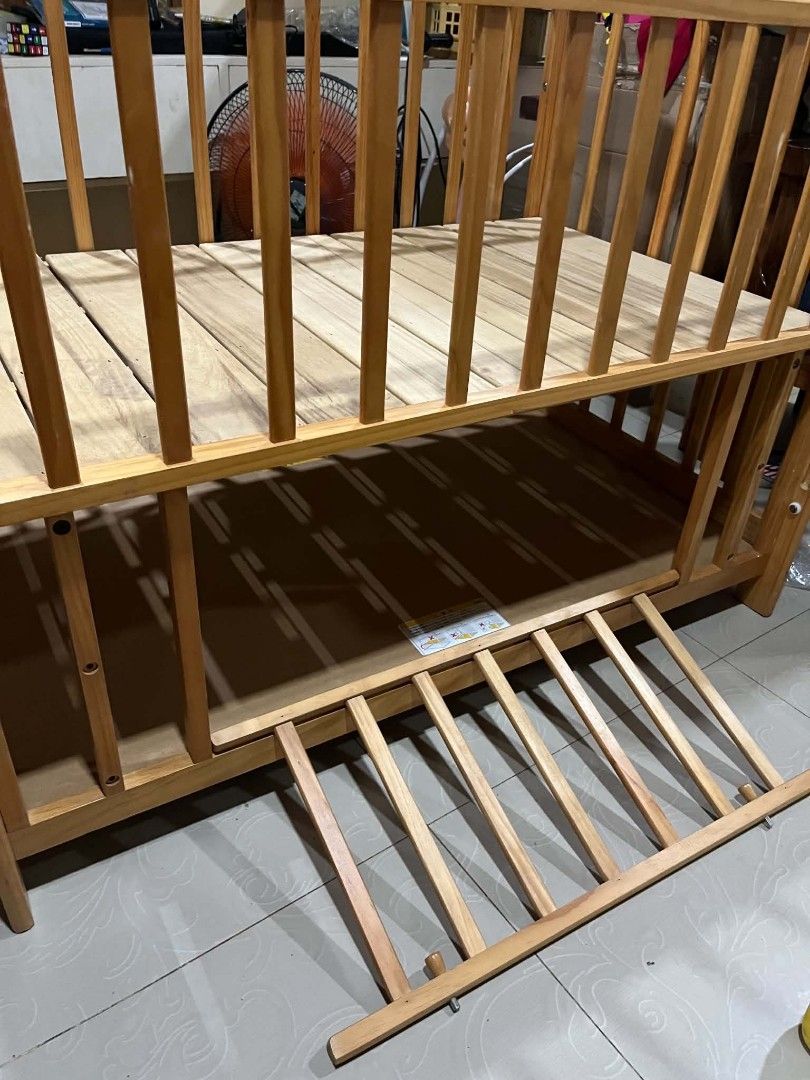 Wooden Baby Crib with Adjustable Side (Category: Cots & Cribs) located in Cavite. Submitted by dimple082 (Listing ID 1462601833, Image 2). Description: - Solid wood construction for durability - Natural wood finish complements any nursery - Lowering side panel for easy access to your baby - Two adjustable mattress levels to grow with your child - Sturdy and safe, ready for a new home.