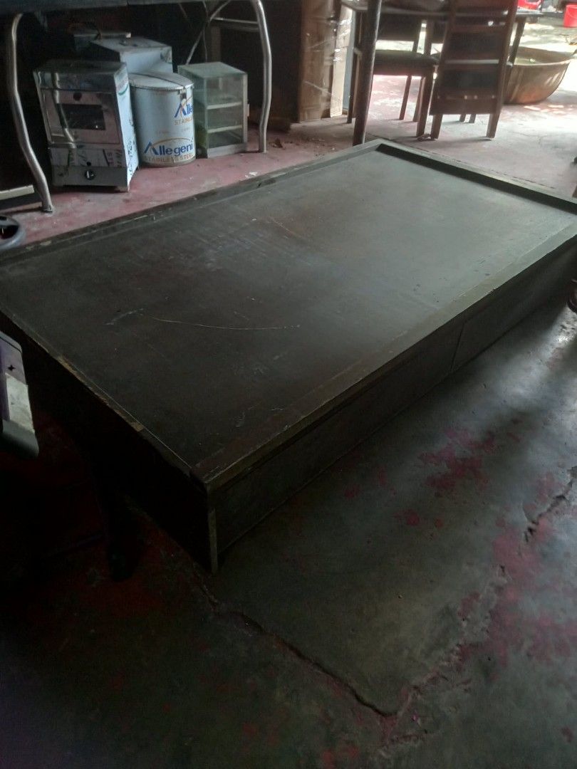 Wooden bed frame with dark mattress platform (Category: Bed Frames & Mattresses) located in Quezon City. Submitted by madelrivera (Listing ID 1462459740, Image 2). Description: WOODEN BED FRAME WITH 2 DRAWERS 1.1 m '2m for sale 2500 location Carlos extension San Bartolome NOVA QC.