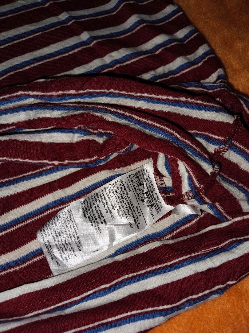 XXL Authentic Levi's stripe tee (Category: Tshirts & Polo Shirts ) located in Mabalacat. Submitted by al_amin_thrift (Listing ID 1462560339, Image 2). Description: Levi’s Retro Stripe Pocket Tee — Size XXL ​ - ✅ Authentic Levi’s — iconic heritage brand ​ - Timeless retro stripe: burgundy / white / blue ​ - Signature red Levi’s tab on chest pocket ​ - Soft lightweight cotton — all‑day comfort ​ - Size: XXL — measurements L29" × W27" ​ - Pre‑owned: