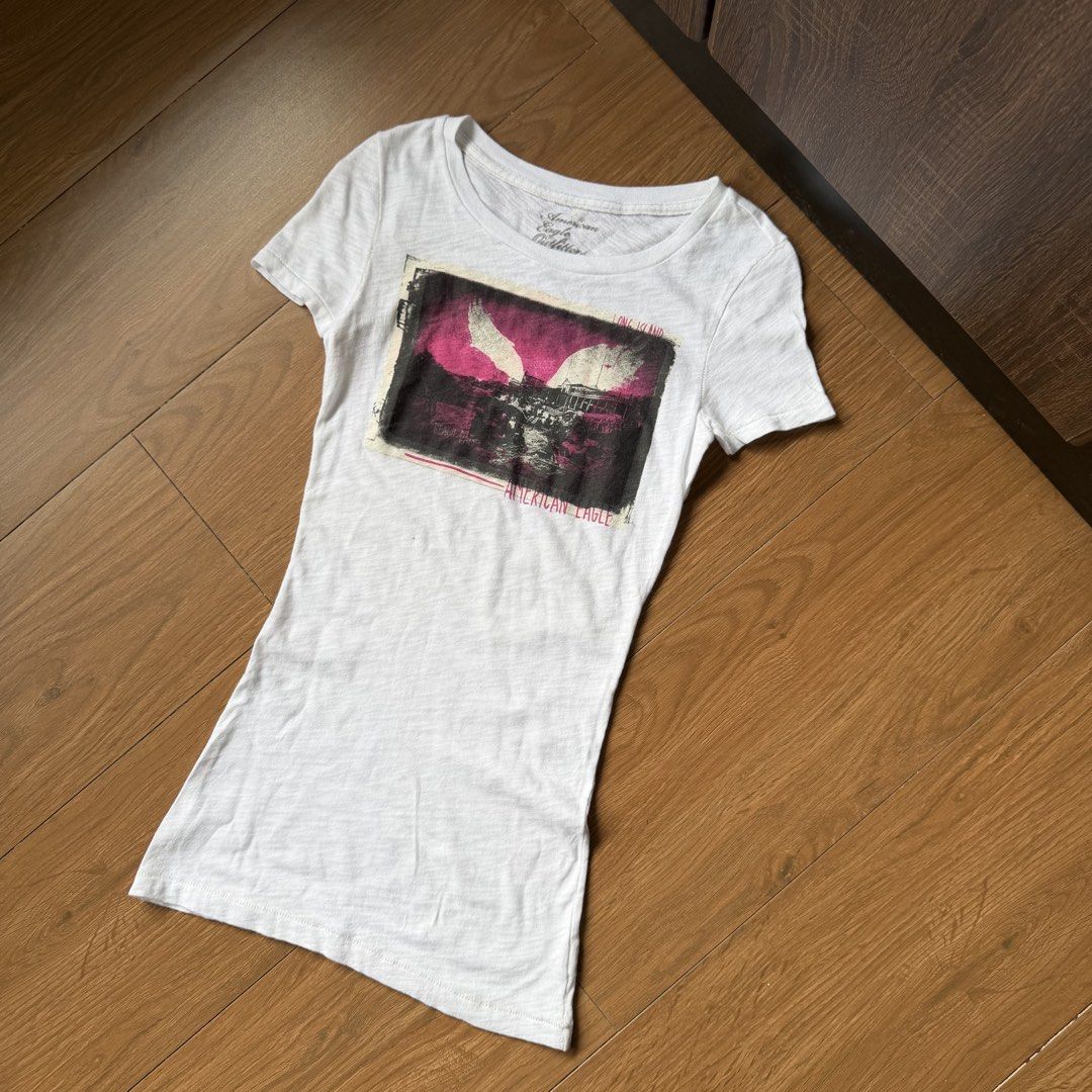 Y2k american eagle white graphic top (Category: Shirts) located in Angeles City. Submitted by sadgurlsneedmoney_ (Listing ID 1462553534, Image 1). Description: .