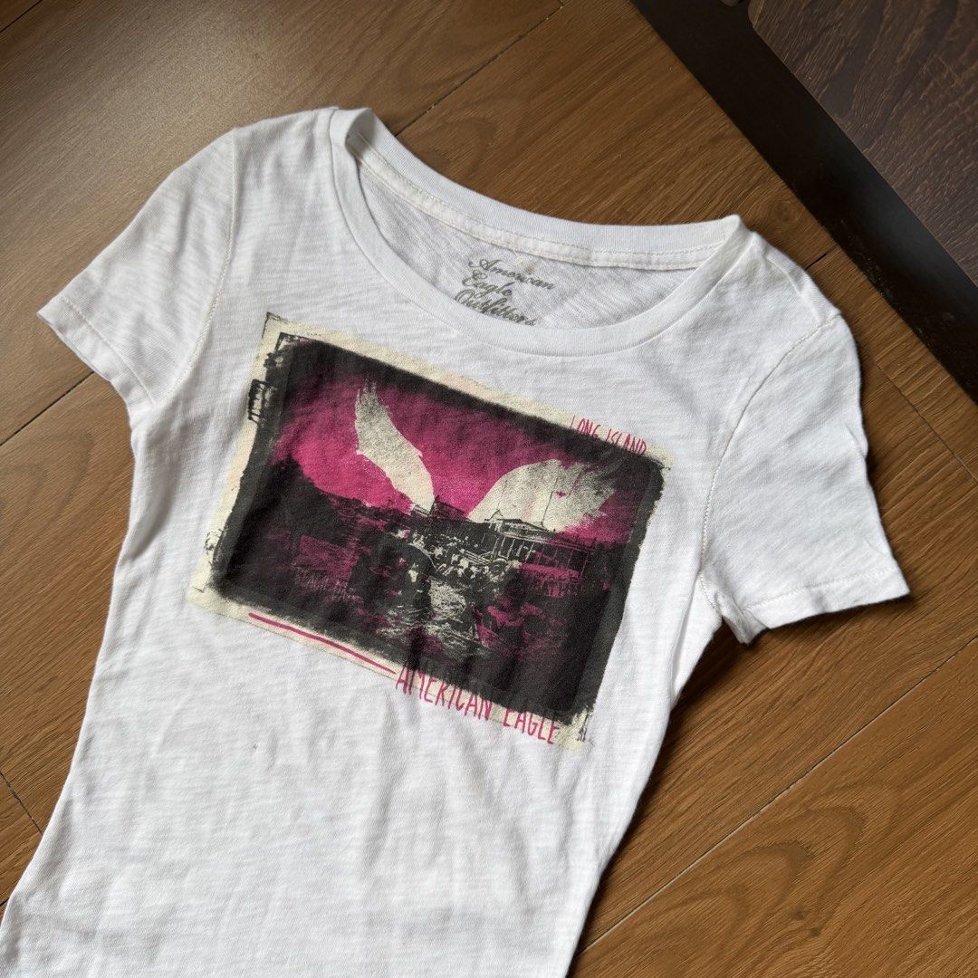 Y2k american eagle white graphic top (Category: Shirts) located in Angeles City. Submitted by sadgurlsneedmoney_ (Listing ID 1462553534, Image 2). Description: .