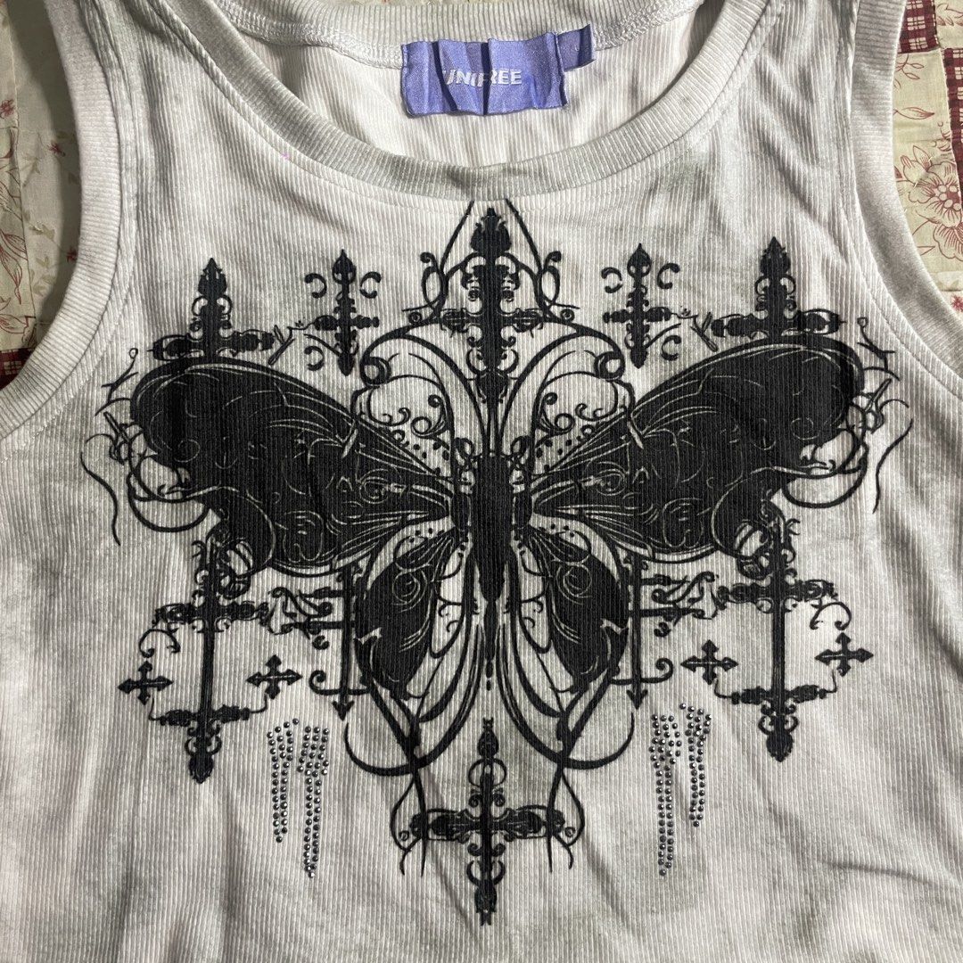 Y2K butterfly crop top with rhinestones (Category: Sleeveless) located in Baguio. Submitted by emira.seoul (Listing ID 1462512201, Image 2). Description: - Y2k vibes - new condition - no flaws - size xs to medium - washed and ready to use ᥫ᭡.ִֶָ𓂃.