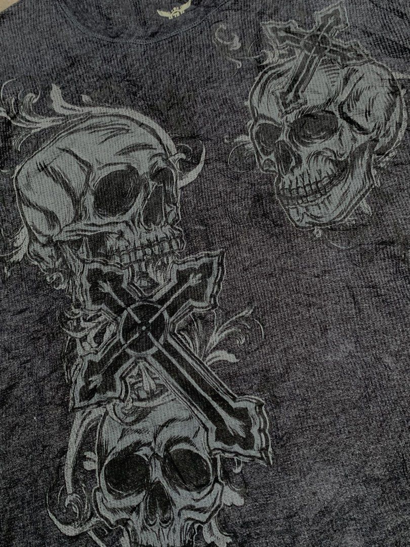 Y2k jumbo print Skull cross (Category: Tshirts & Polo Shirts ) located in Roxas City. Submitted by vaultcultureco. (Listing ID 1462637810, Image 3). Description: - Brand: American Eagle - Style: Y2k long sleeve shirt - Color: Dark Grey - Material: Waffle knit fabric - Design: Jumbo print featuring skulls and crosses - Fit: Casual wear.