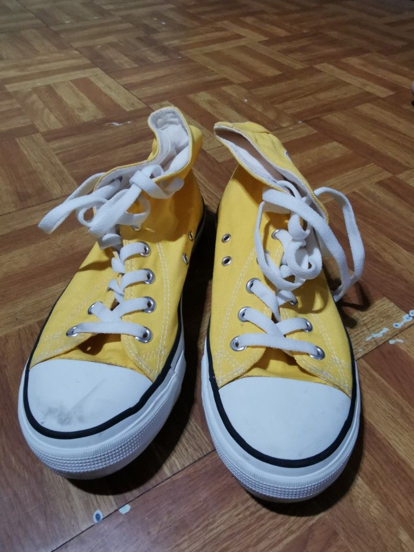 Yellow High Cut Sneakers "Since 1971" Collection (Category: Sneakers) located in Caloocan City. Submitted by mjmnacino204562 (Listing ID 1462559612, Image 1). Description: - Yellow high-top sneakers - "Since 1971" graphic on the side - Lace-up closure - White sole with black trim - Size 40 (25cm) - Ideal for casual wear - Minor marks on toe area (please check photos for details) RFS: No longer needed USED ONCE.
