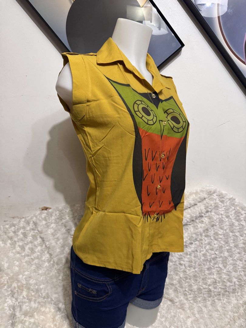 Yellow Owl Print Sleeveless Collared Blouse (Category: Blouses) located in Marikina City. Submitted by lorradel (Listing ID 1462456422, Image 2). Description: - just buy 1 item - Cute yellow sleeveless blouse - Collared neckline - Button-up front - Fun owl graphic (green, orange, black) - Ideal for casual outings - Pairs well with jeans or shorts ****091326 cocopandansack together with 091326 1-10plastic.