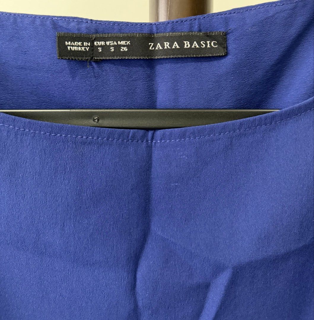 Zara Basic Blouse (Category: Longsleeves) located in Kuala Lumpur. Submitted by clothes.clothes_clothes (Listing ID 1462514827, Image 2). Description: Zara Basic Colour : Blue Neckline: Boat neck Design: Button down back Material : Georgette .