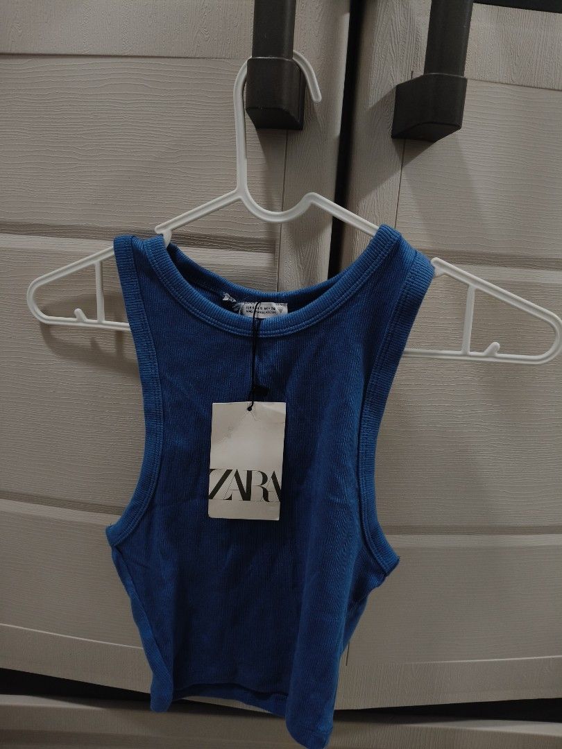Zara Blue Ribbed Tank Top (Category: Sleeveless) located in Manila. Submitted by hellocaea010894 (Listing ID 1462599598, Image 1). Description: - Blue ribbed tank top from Zara - Sleeveless with a racerback design - Stretchy fabric for a comfortable fit - Versatile for casual wear or layering - Can be dressed up or down.