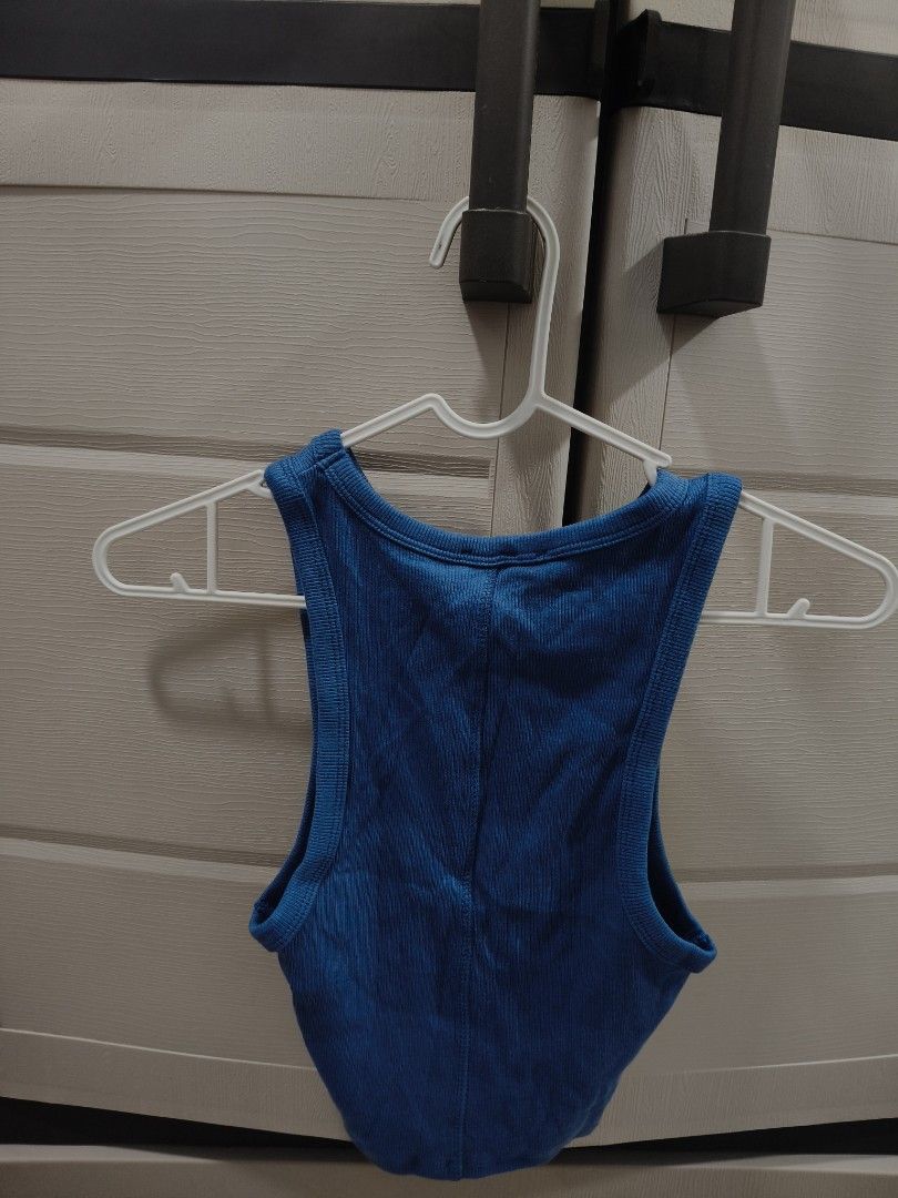 Zara Blue Ribbed Tank Top (Category: Sleeveless) located in Manila. Submitted by hellocaea010894 (Listing ID 1462599598, Image 2). Description: - Blue ribbed tank top from Zara - Sleeveless with a racerback design - Stretchy fabric for a comfortable fit - Versatile for casual wear or layering - Can be dressed up or down.