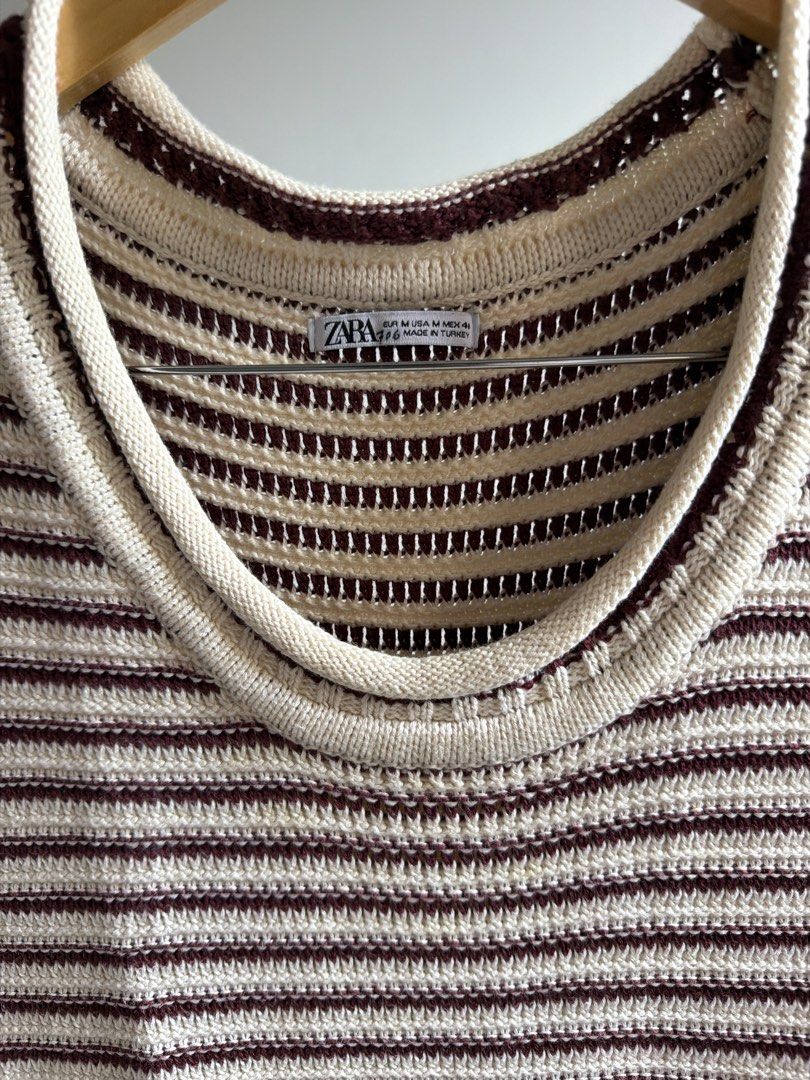 ZARA Striped Knit Sleeveless Top (Category: Tshirts & Polo Shirts ) located in Cavite. Submitted by toshiakihabara (Listing ID 1462467763, Image 2). Description: - Cream and maroon striped knit sleeveless top - Brand: ZARA - Neckline: Crew neck - Estimated Size: Medium - Versatile: Great for layering or wearing on its own - Style: Casual and comfy.