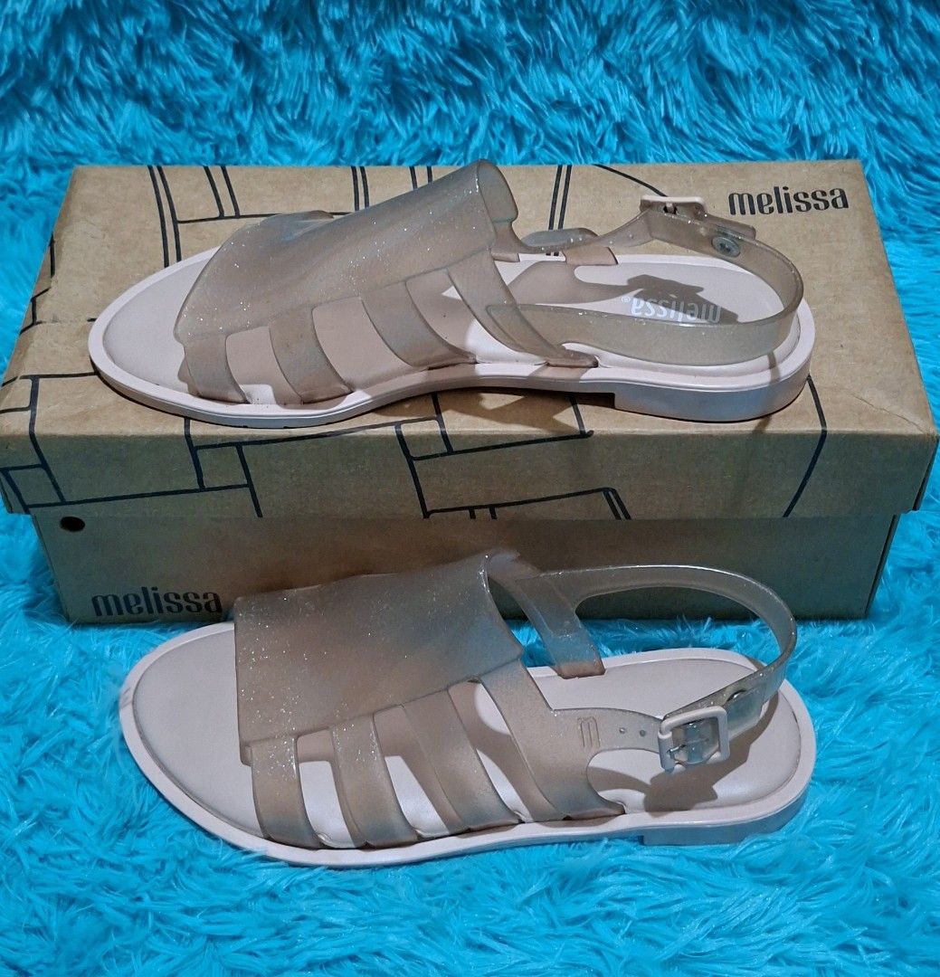 100% ORIGINAL MELISSA (Category: Flats & Sandals) located in Manila. Submitted by mydytrends (Listing ID 1462857880, Image 2). Description: NEGO PRICE FOR SURE MINER 🥰 - 100% Original Melissa sandals - Size: EU 37 (UK 6 / US 6) - Material: Signature Melissa jelly with subtle glitter - Design: Classic sandal style with adjustable strap - Condition: New, comes with original Melissa box.