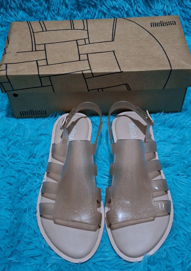 100% ORIGINAL MELISSA (Category: Flats & Sandals) located in Manila. Submitted by mydytrends (Listing ID 1462857880, Image 1). Description: NEGO PRICE FOR SURE MINER 🥰 - 100% Original Melissa sandals - Size: EU 37 (UK 6 / US 6) - Material: Signature Melissa jelly with subtle glitter - Design: Classic sandal style with adjustable strap - Condition: New, comes with original Melissa box.
