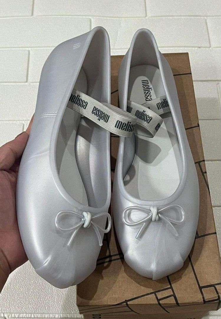 100% original.melissa (Category: Flats & Sandals) located in Manila. Submitted by mydytrends (Listing ID 1462856208, Image 2). Description: - 100% Original Melissa Sophie flats - Available in sizes 5, 6, 7, 8, 9, 10 - Classic jelly material - Features a cute bow accent - Comfortable and stylish design.