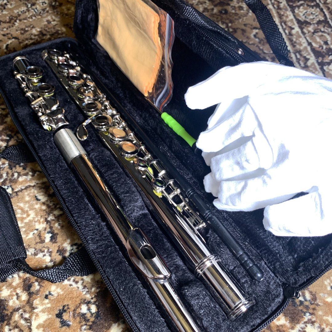 16-Hole C Key Closed-Hole Silver Flute Set | PRICE IS FIXED (Category: Musical Instruments) located in General Trias. Submitted by thegearstashofc (Listing ID 1462857721, Image 3). Description: - Silver flute - Black carrying case with shoulder strap - Includes cleaning rod, cloth, and white gloves - Ideal for beginner or intermediate players.