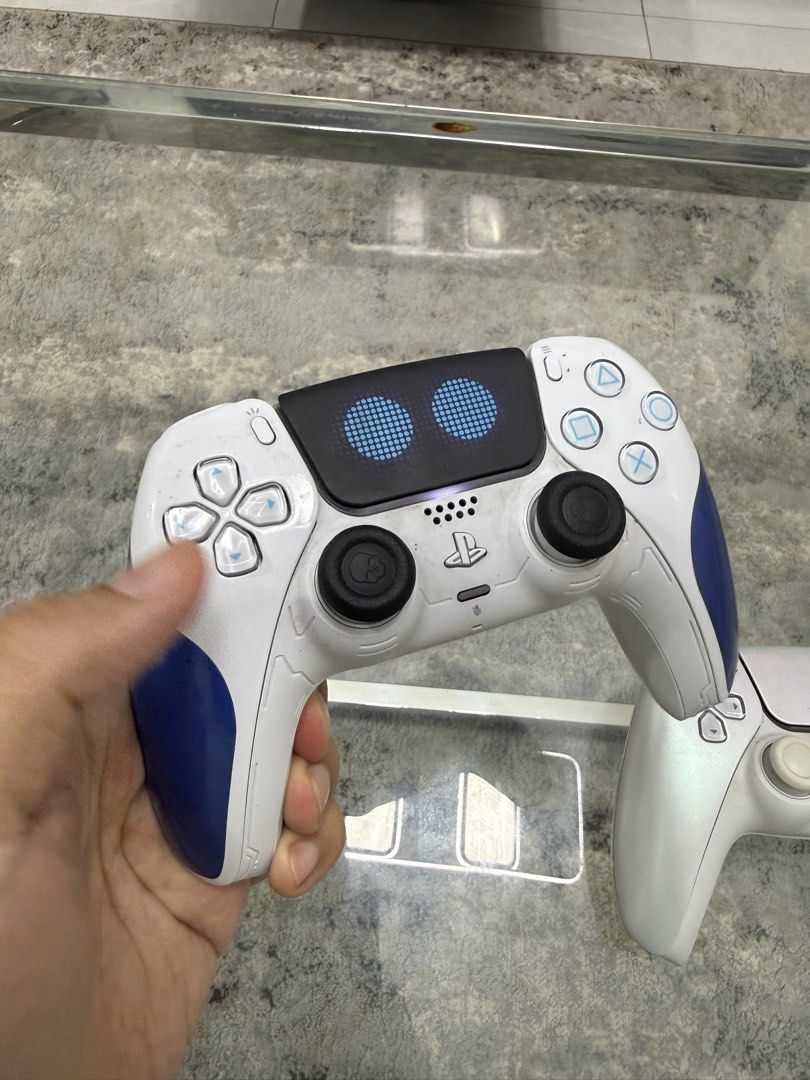 2 pcs Limited edition Ds5 controller Astro bot and Pearl white (Category: PlayStation) located in San Juan City. Submitted by pureswiss (Listing ID 1462708176, Image 2). Description: Rush for sale.Limited editions controller bot working very good conditions..